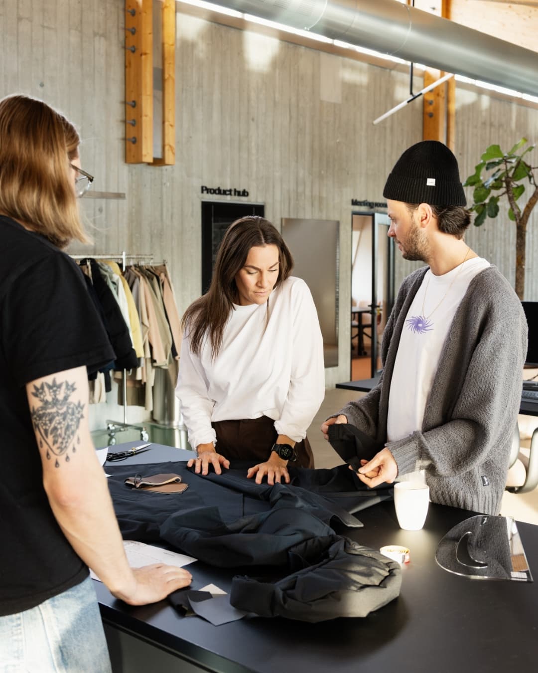 People from the BLÆST team discussing the design on one of their jackets